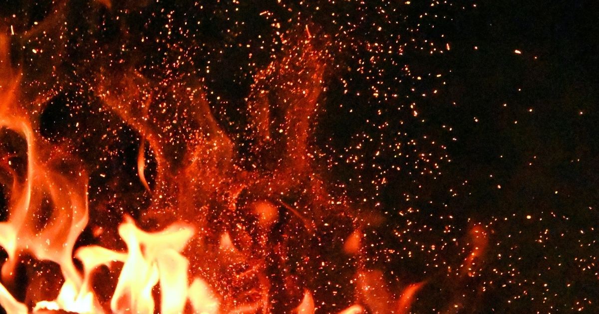 In what ways is the Holy Spirit like a fire?