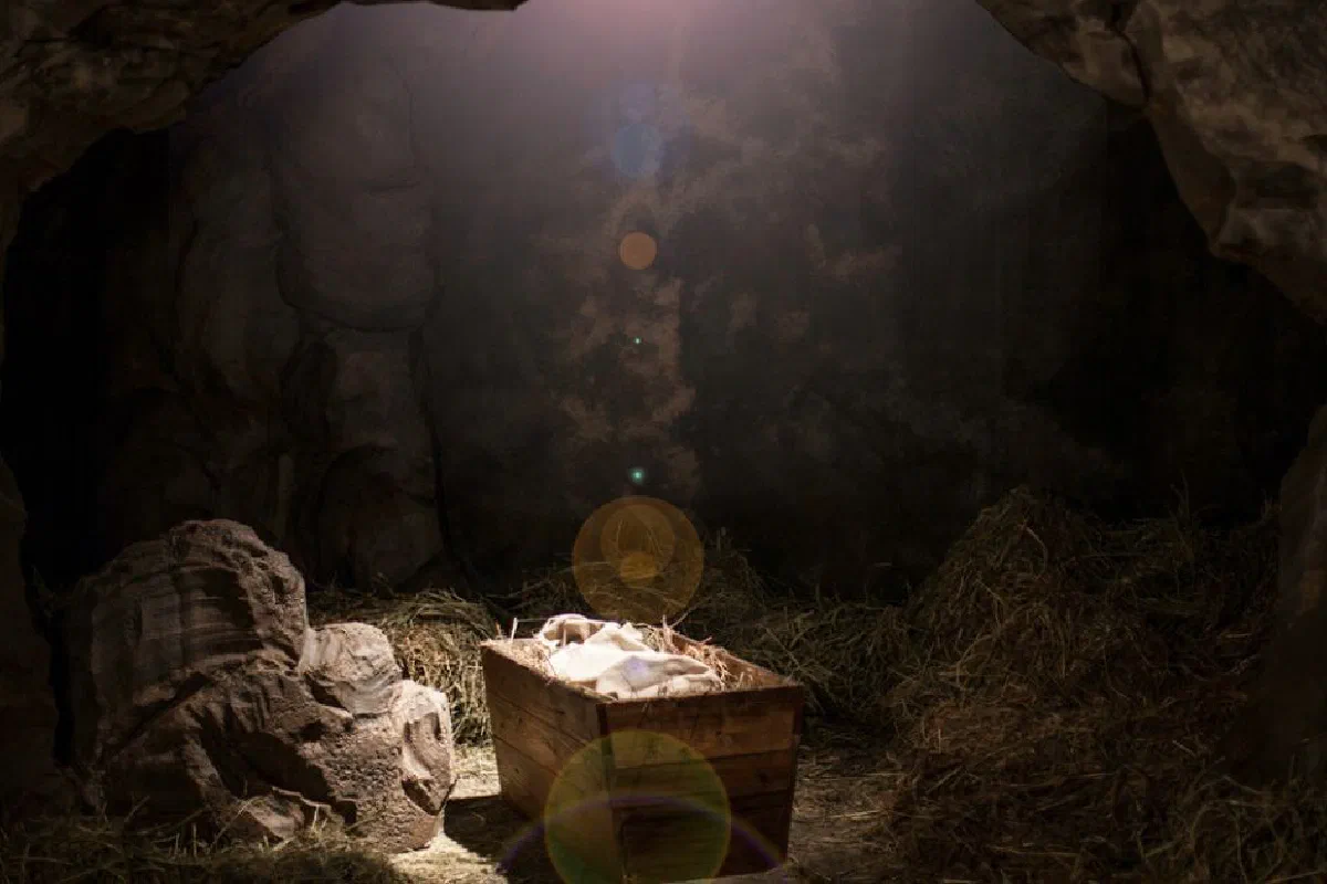 What is the significance of Jesus being born in a manger?