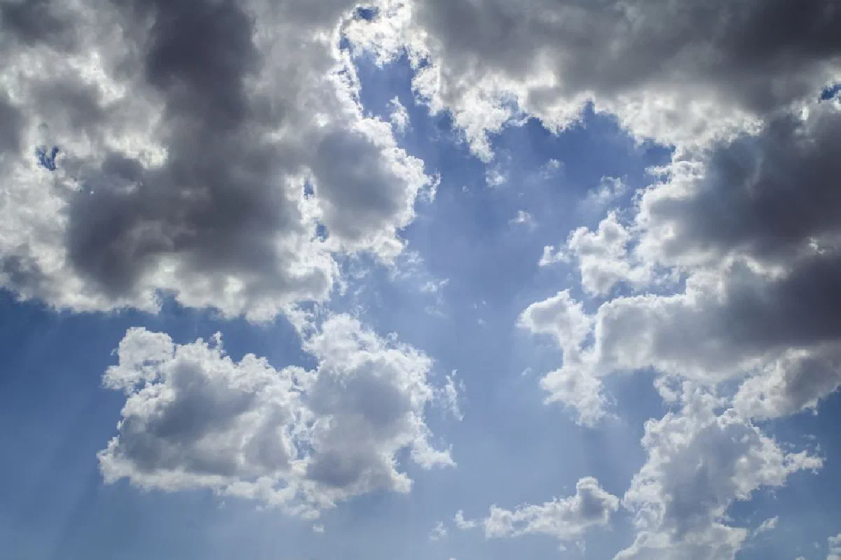 A stunning view of dramatic clouds against a bright blue sky, capturing the essence of a sunny day.