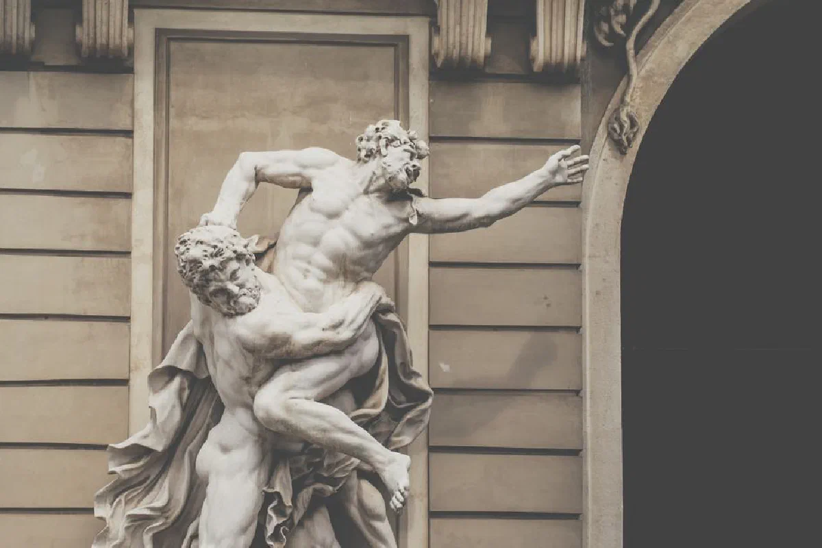 Intricate Baroque marble statue depicting dynamic figures in Vienna, Austria.