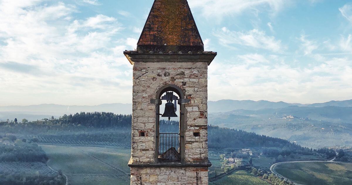 What is the purpose of church bells? Where did the tradition of church bells originate?