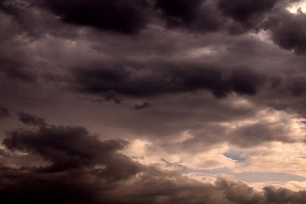 Dark storm clouds gather over Guaratuba, Brasil, creating a dramatic weather scene.
