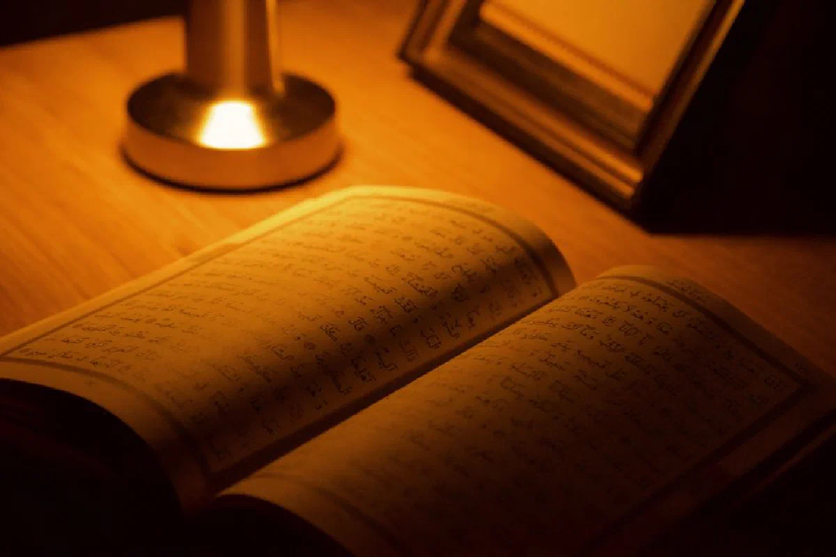 An open book illuminated by a warm lamp, perfect for a quiet evening read.