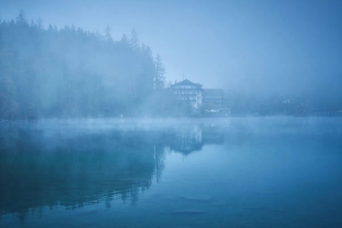 Serene misty morning lake view in Grainau, Bavaria, Germany.