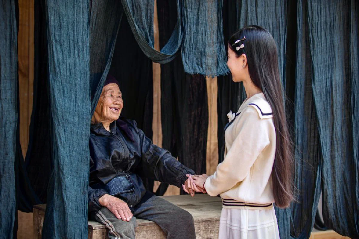 A young woman and an elderly lady sharing a moment of warmth and connection.