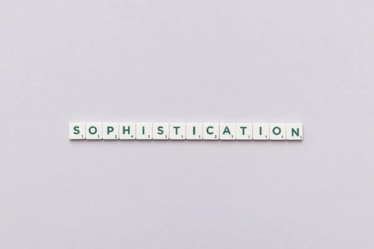 Letter tiles spelling out 'Sophistication' on a neutral background, perfect for conceptual themes.