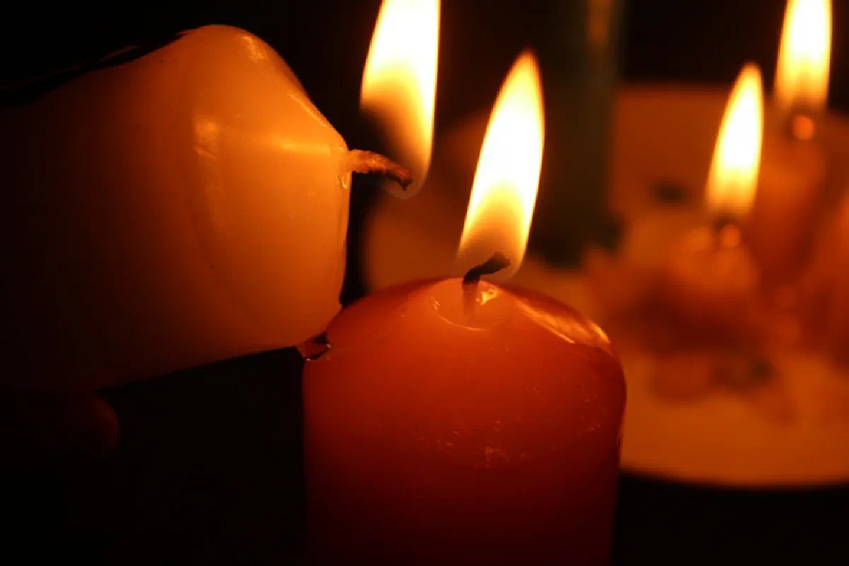 Warm glow of burning candles creating a serene atmosphere.