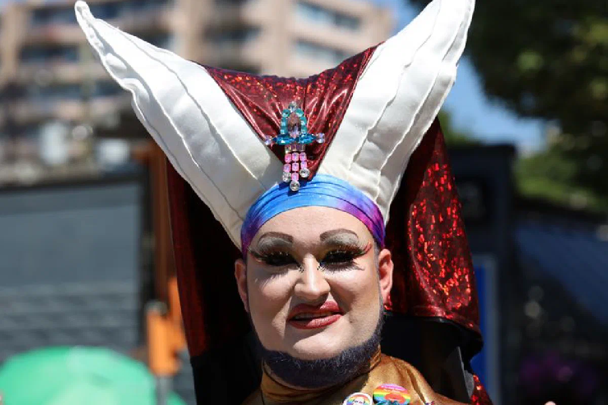 Vibrant festival portrait featuring ornate costume and dramatic makeup.