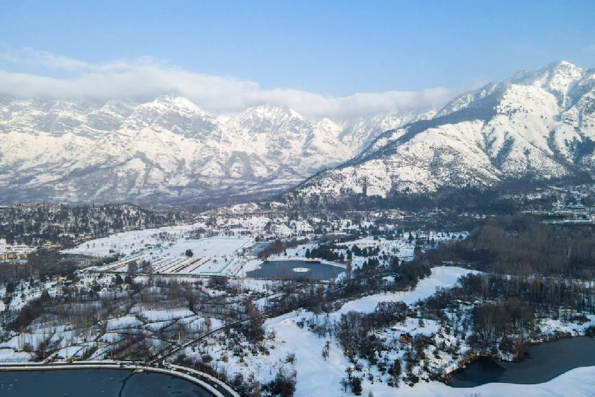 A breathtaking aerial view capturing the snow-covered mountains of Srinagar during winter.