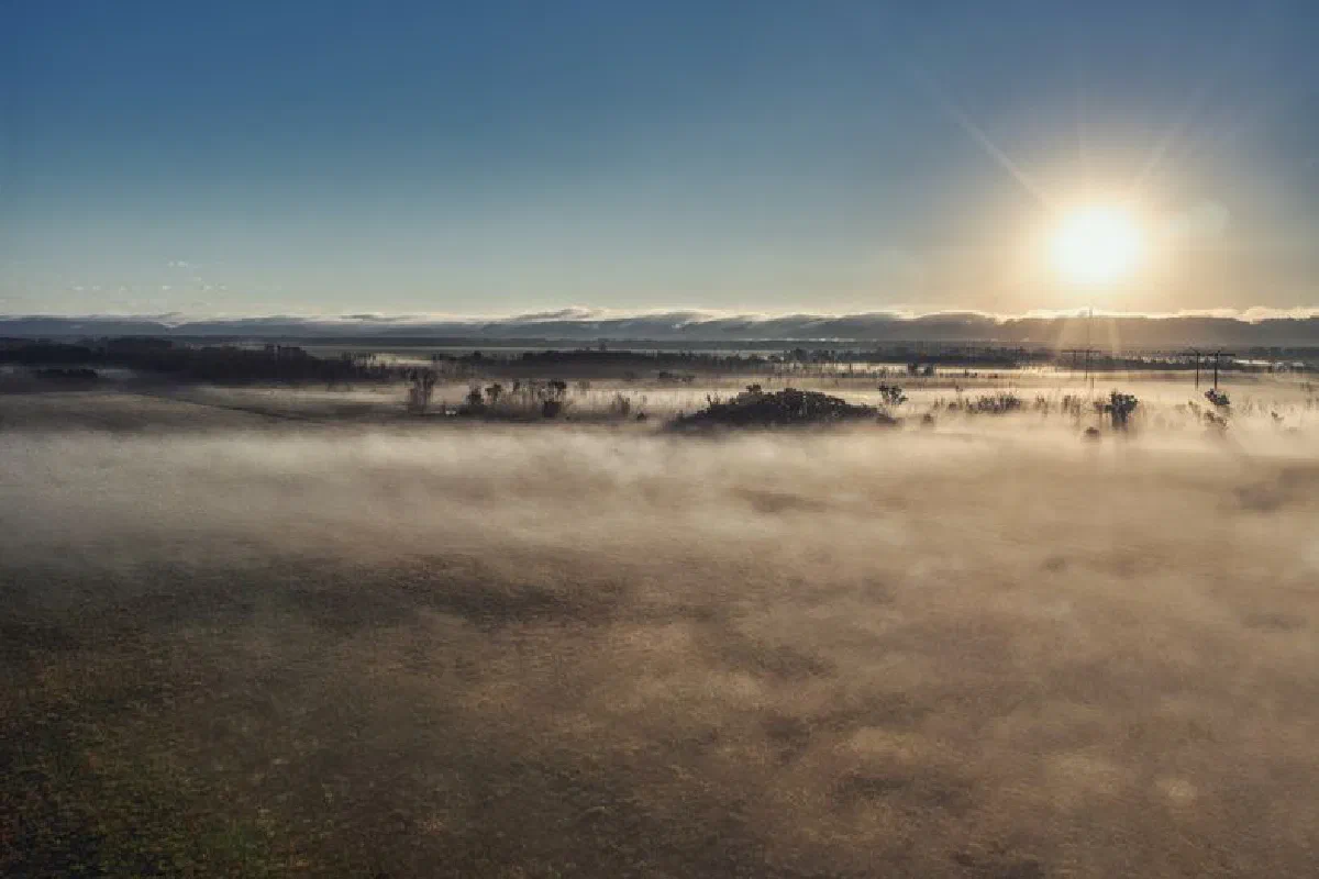 Breathtaking sunrise over a foggy plain in Kellogg, MN, USA, capturing nature's tranquility.