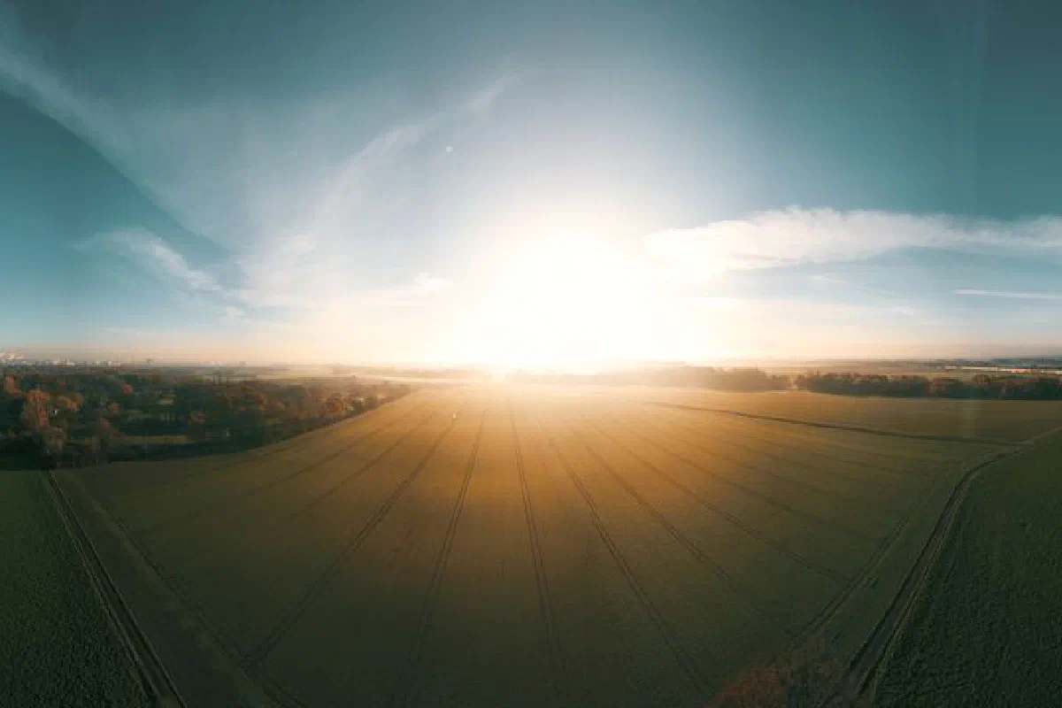 Stunning aerial view of sunny fields near Krefeld, Germany, captured at sunrise.