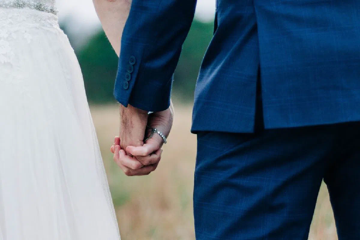 If a man is married to a divorced woman, can he serve in church leadership?