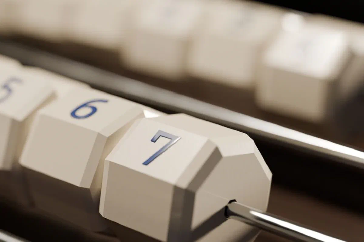 Macro shot of an abacus focusing on numbers five through seven in a modern design.