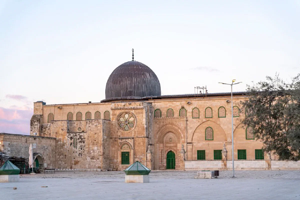 Beautiful view of Al-Aqsa Mosque's facade and dome in Jerusalem during dusk.
