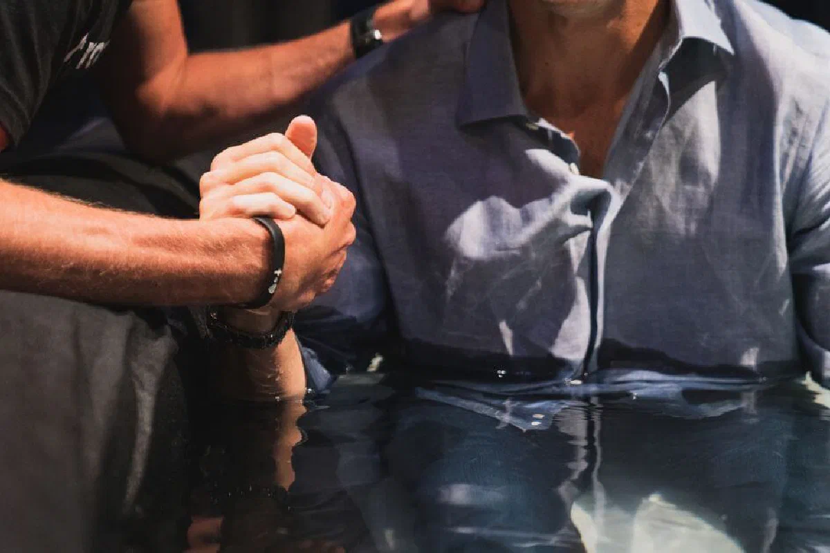 What does water baptism symbolize?