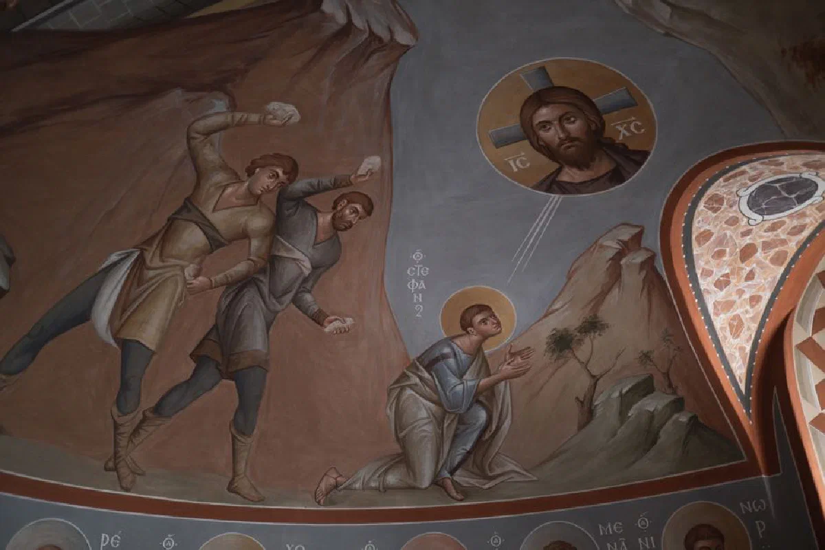 Intricate fresco in a church showcasing a biblical scene with vibrant religious art.