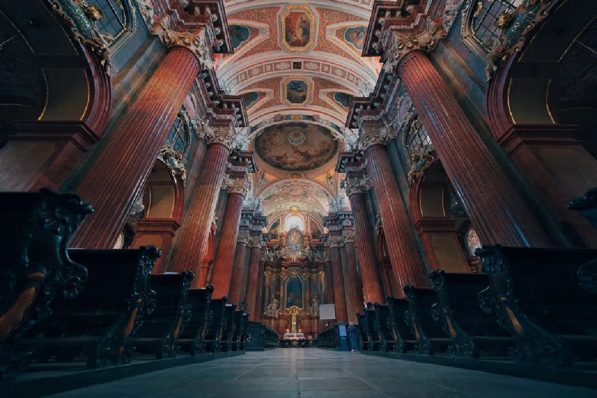 A stunning view of the ornate Baroque interior of a cathedral in Poznań, Poland.