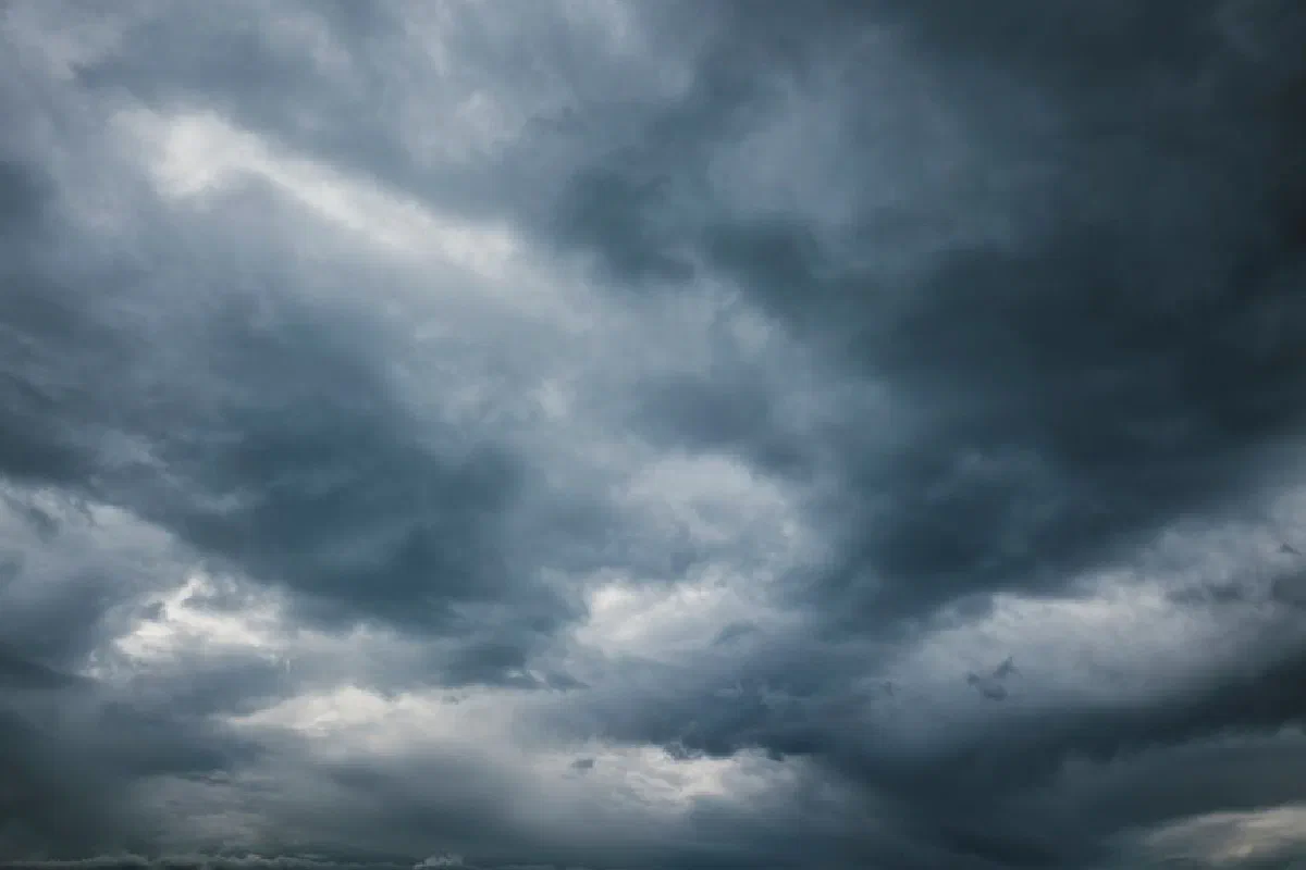 Moody sky with thick storm clouds, capturing the essence of an approaching storm.