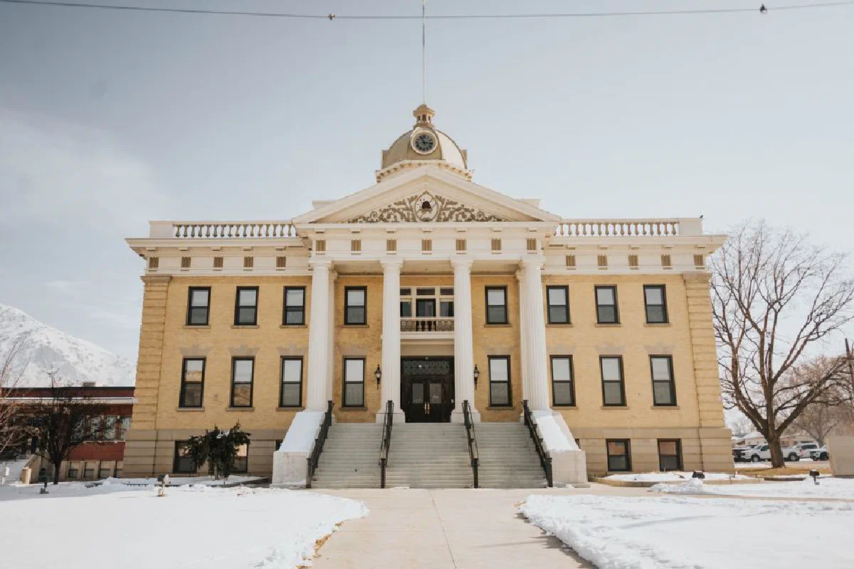 A prominent historic building in Brigham City, Utah, covered in snow during winter.
