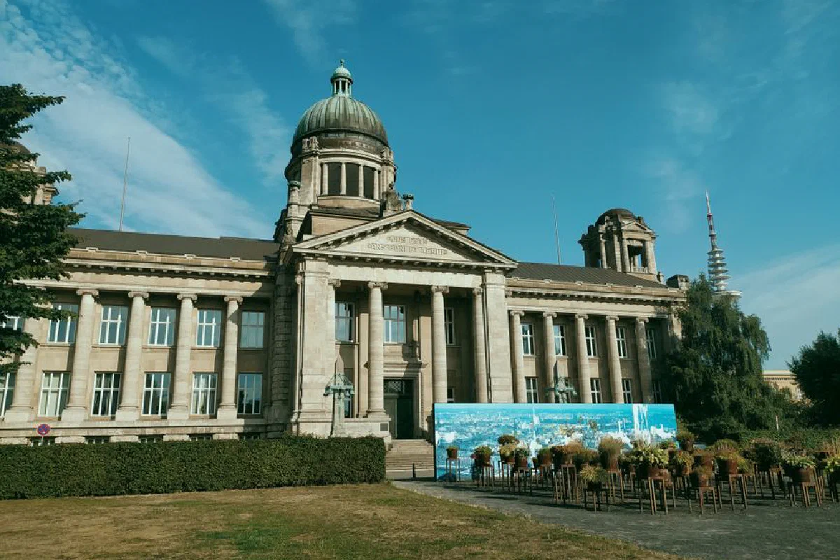 Front view of an elegant old courthouse building in Germany under a clear blue sky.