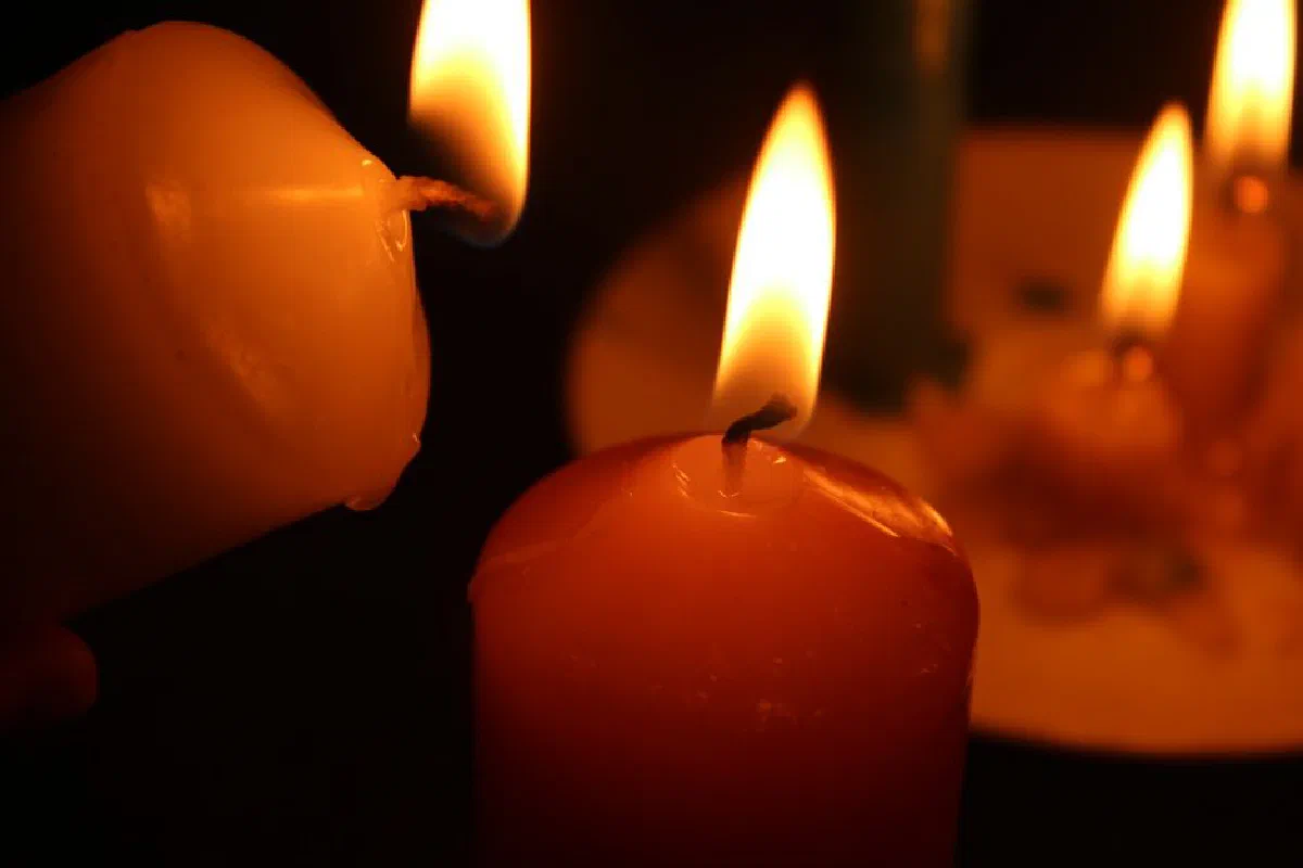Close-up of burning candles creating a warm and intimate atmosphere.