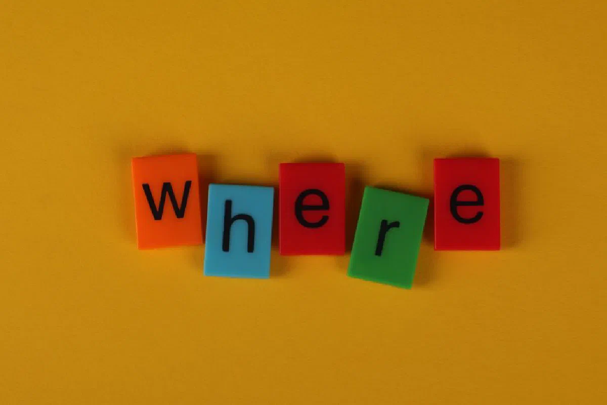 Colorful letter blocks arranged on yellow background spelling 'Where'.
