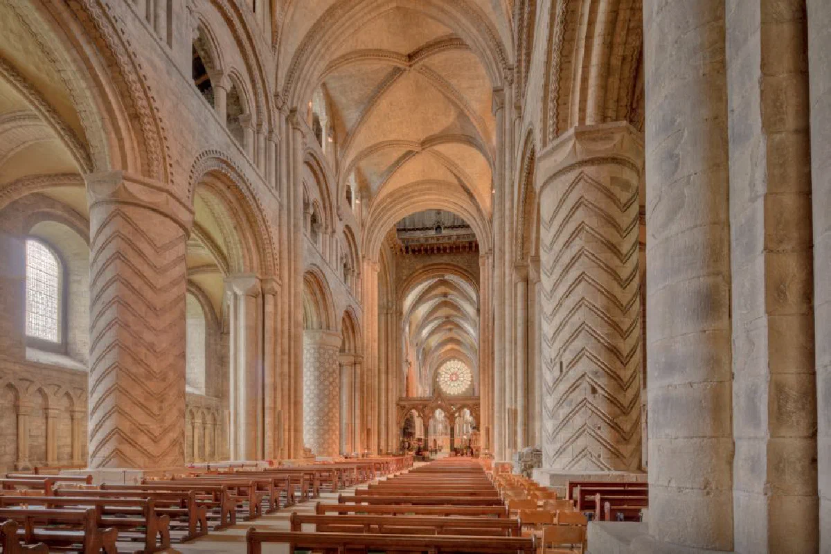Explore the stunning Gothic architecture of Durham Cathedral's nave, a UNESCO World Heritage site in England.