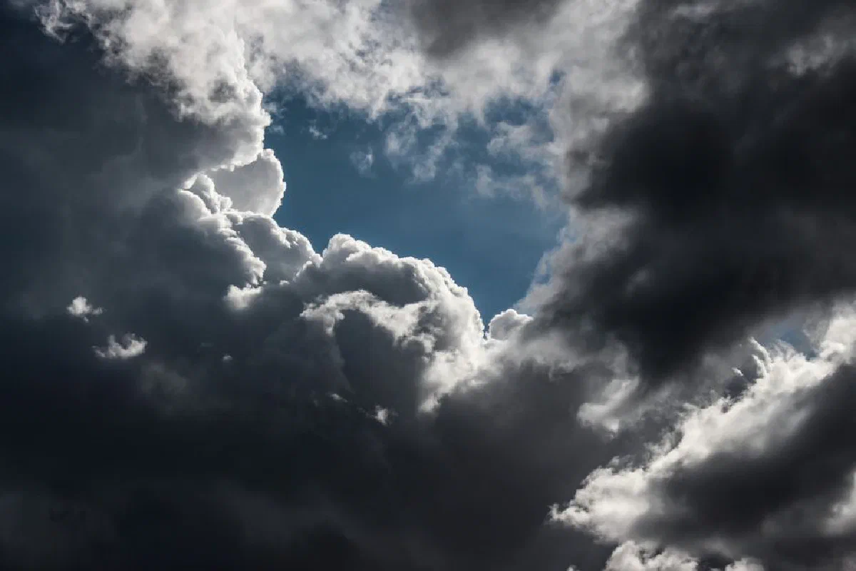 Dramatic cloud formations in the sky over Kavala, Greece, showcasing a moody and dynamic weather scene.