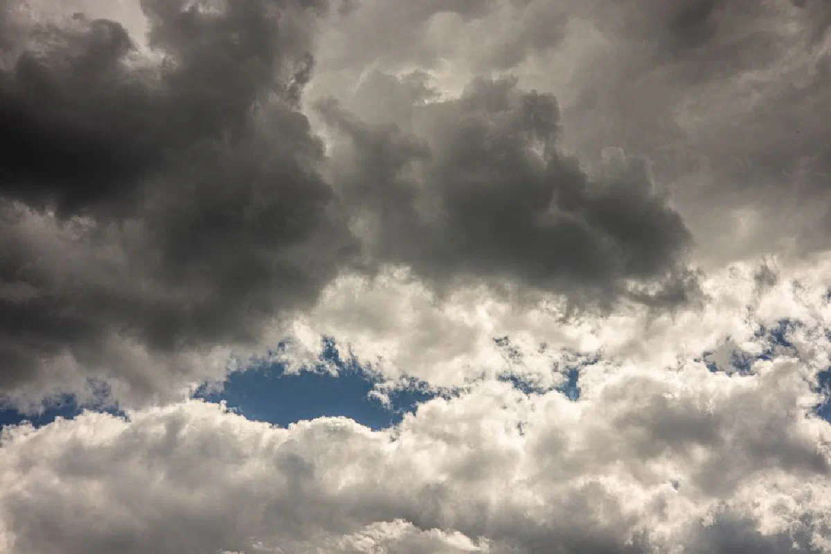 A stunning capture of a dramatic overcast sky filled with dark clouds, perfect for weather-themed projects.