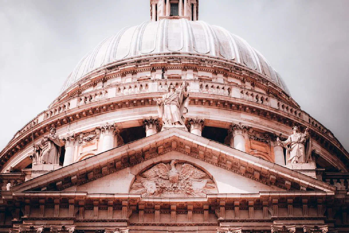 Detailed view of St. Paul's Cathedral dome in London, showcasing its intricate historical architecture.