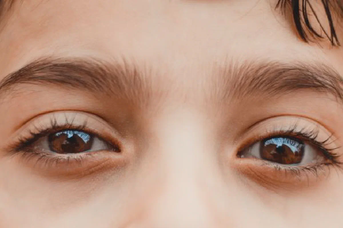 A high-definition close-up focusing on a child's eyes, capturing detail and emotion.