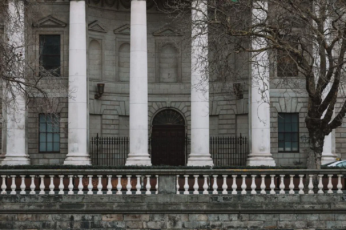 Elegant neoclassical facade of Dublin's Four Courts with iconic white columns.