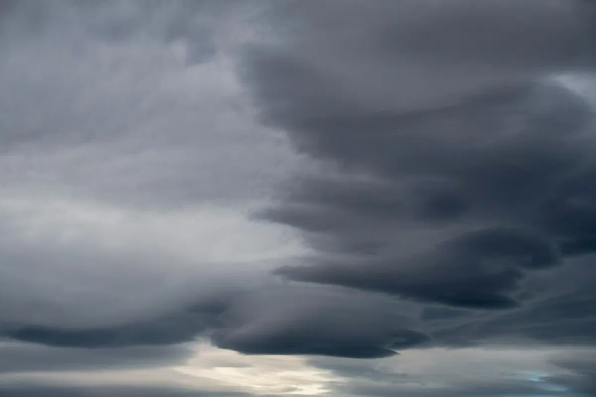 Moody overcast sky featuring layers of dark, dramatic clouds suggesting an impending storm.