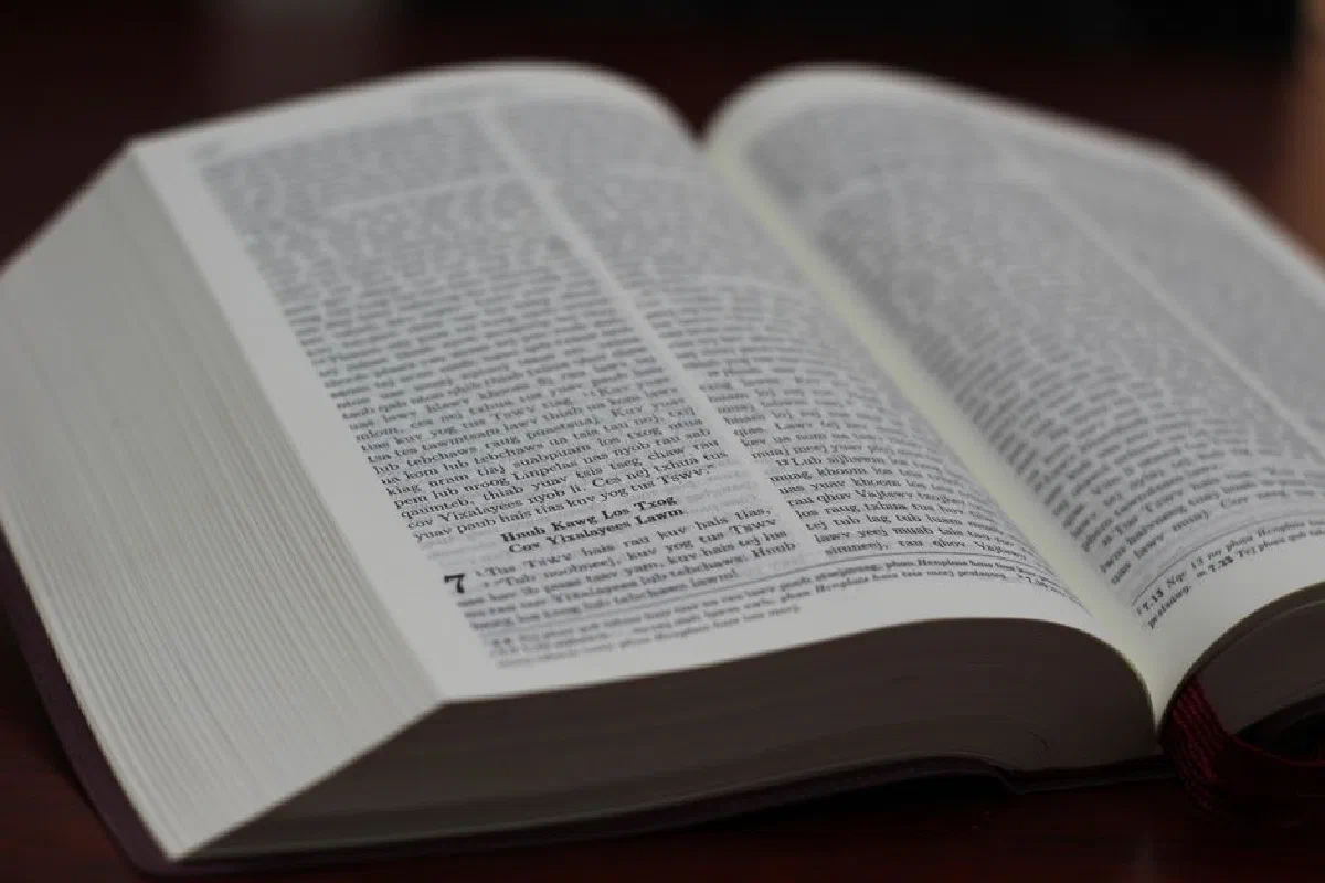 Open Bible with visible text, highlighting scripture details.