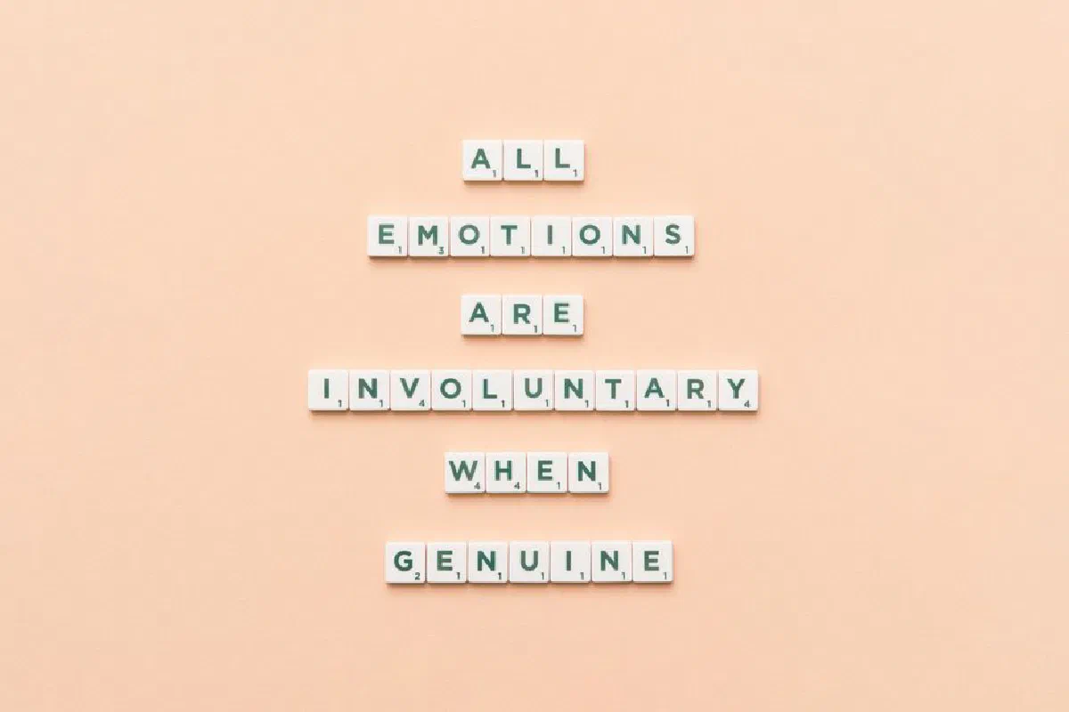 Scrabble tiles forming an inspirational quote, offering a minimalist design on a pastel background.