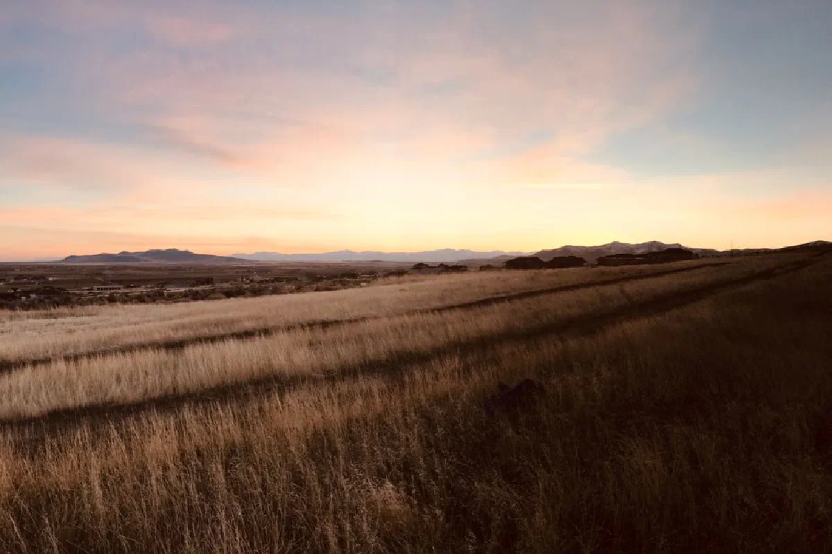 Beautiful fields in Tremonton, Utah with stunning sunrise and mountain views.