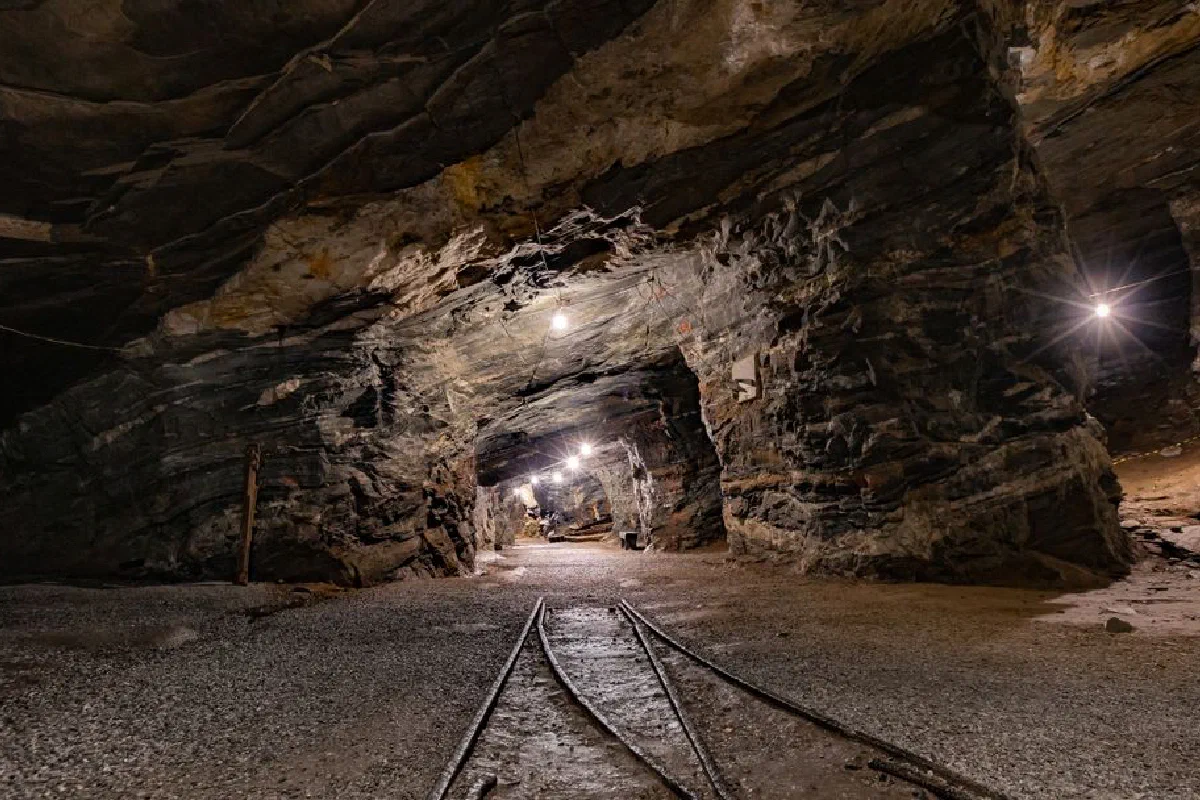 Explore the mysterious depths of Passagem de Mariana, MG, Brazil, with this illuminated underground mine tunnel.