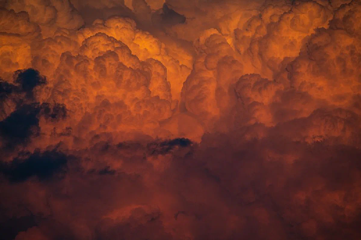 Intense orange cloud formation during sunset creating a dramatic and vivid sky scene.