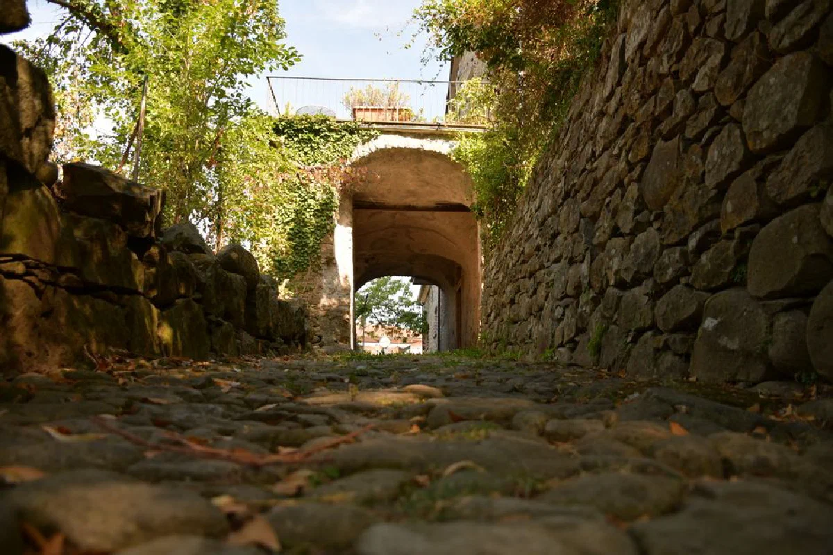 Explore the rustic charm of a cobblestone path in Sesta Godano, Liguria, Italy.