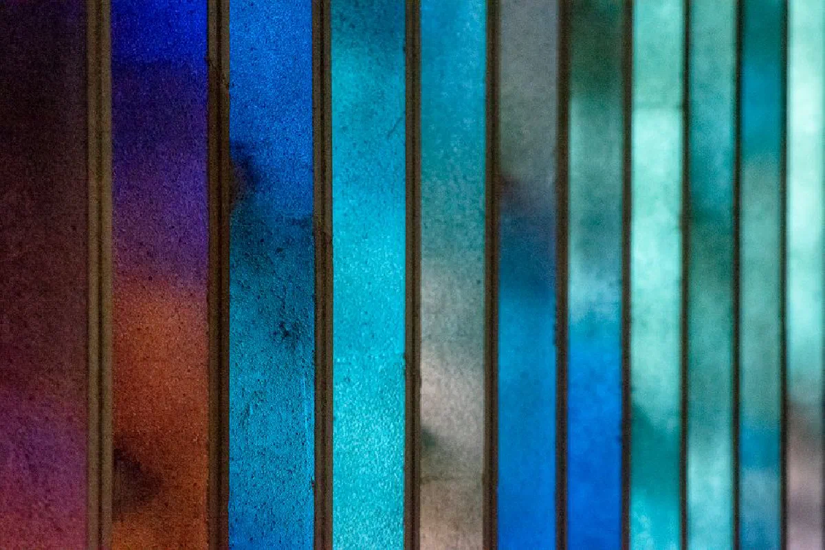 Vibrant abstract of stained glass with blue and purple hues.