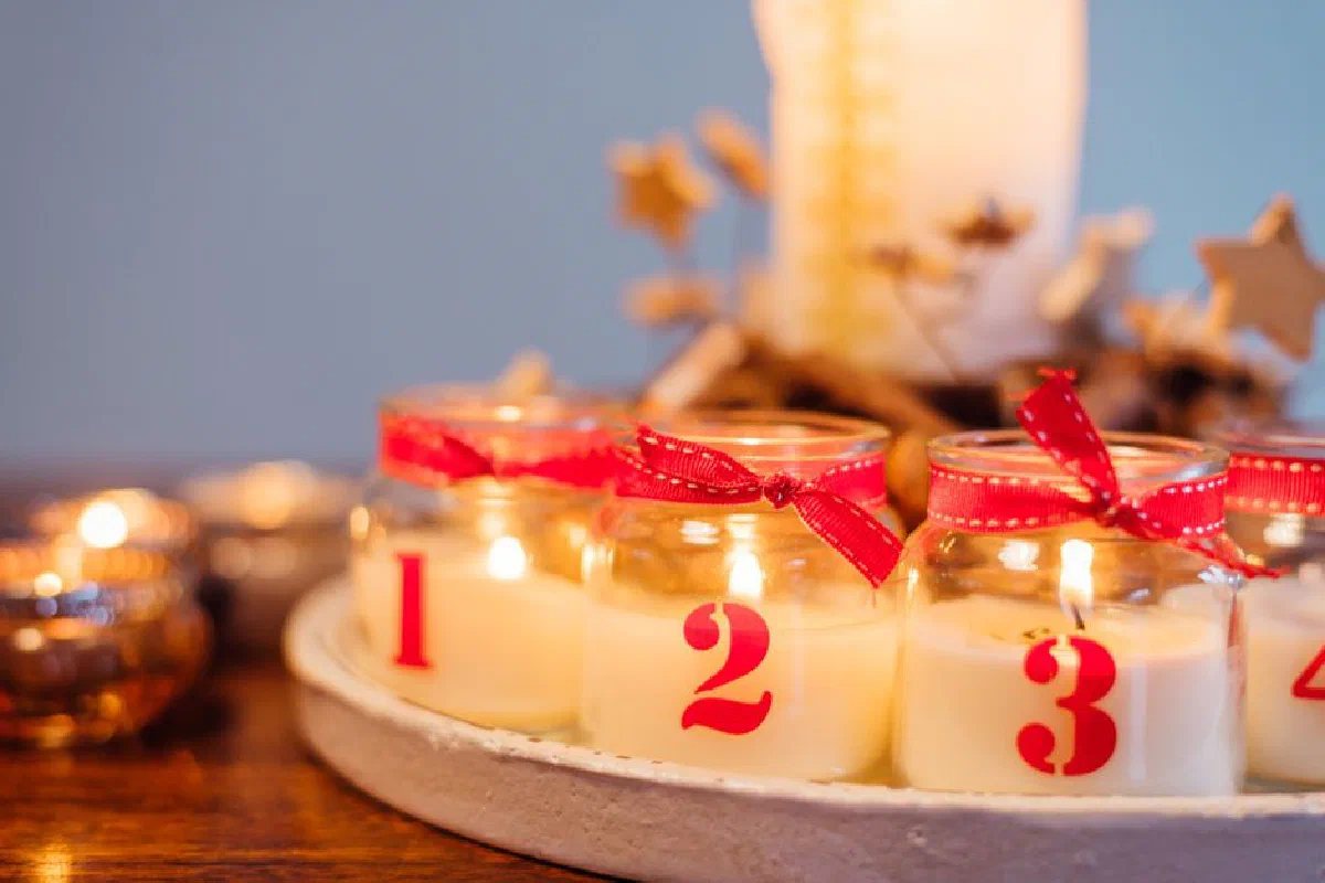 Warm candlelight with numbered jars creating a festive and cozy ambiance.