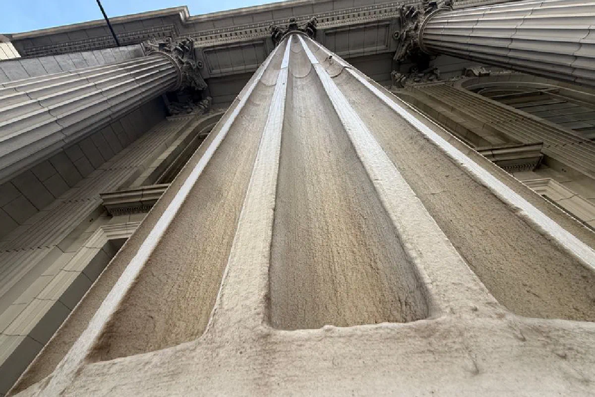 Looking up at a majestic classical column in San Francisco showcasing architectural grandeur.