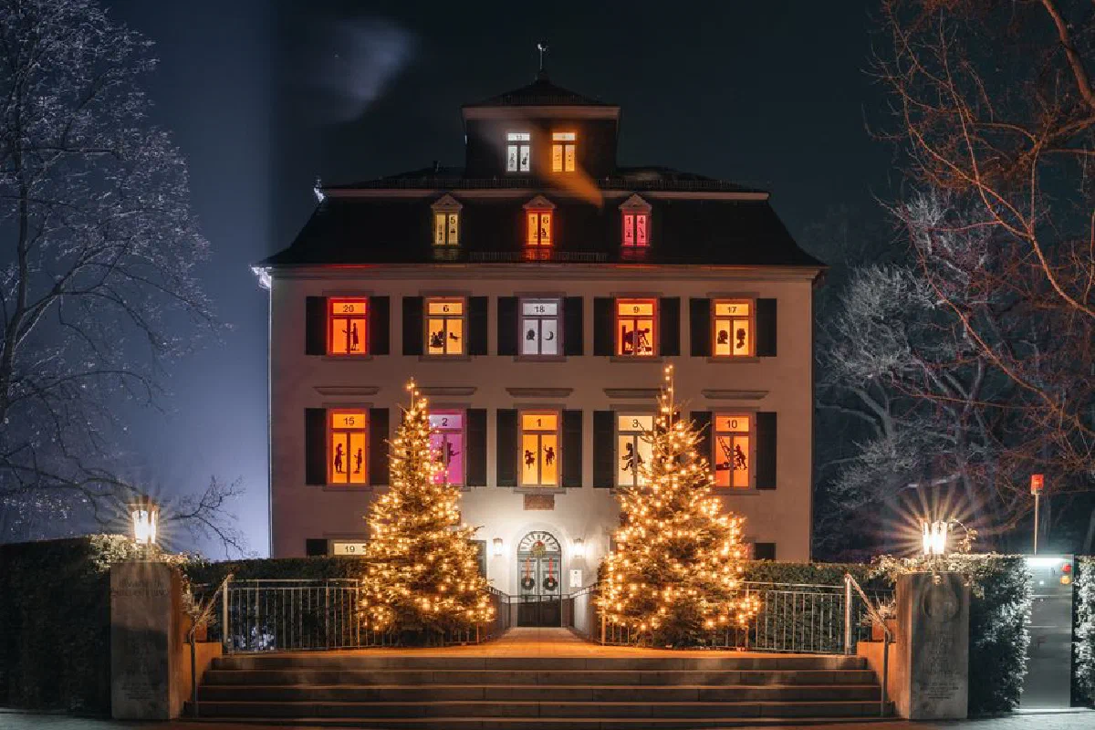 Festive building with Christmas lights and decorations in Frankfurt, Germany during night.