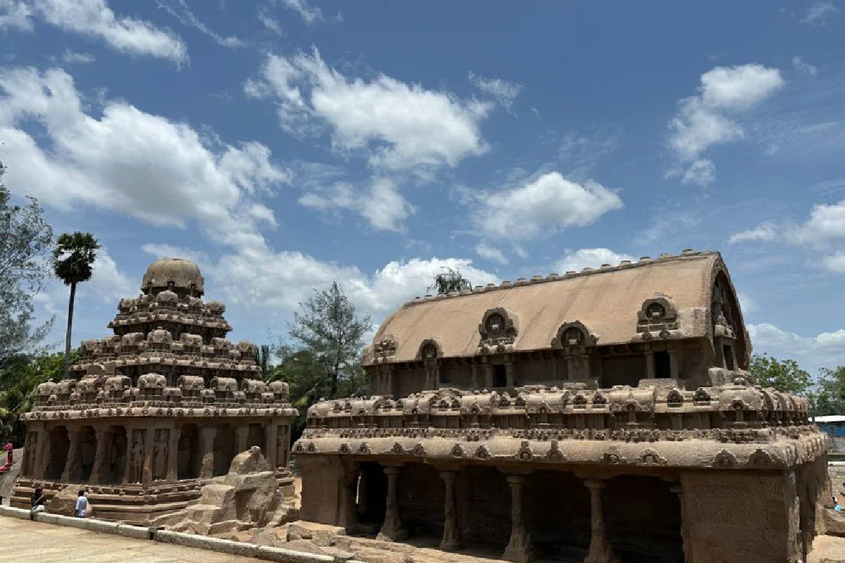 Ancient Pancha Rathas of Mamallapuram, India captured under a bright blue sky with clouds.