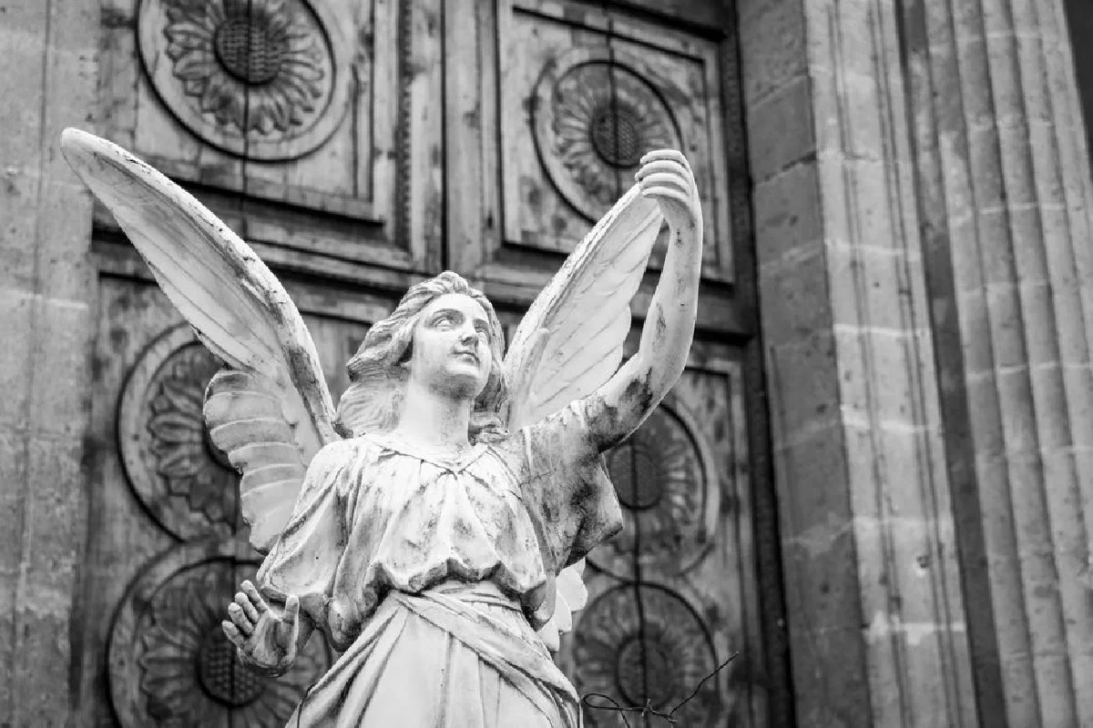 Black and white photo of a majestic angel sculpture in Mexico City.