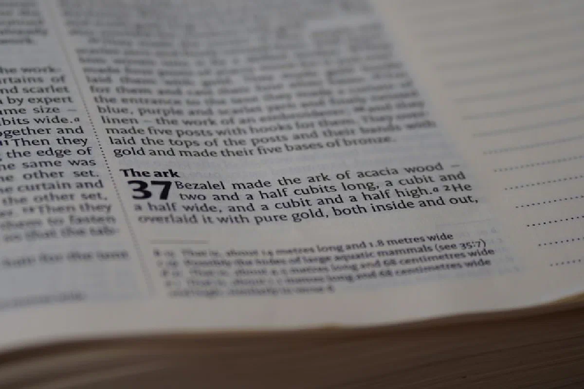 Detailed close-up view of text from a religious book, depicting religious scripture.