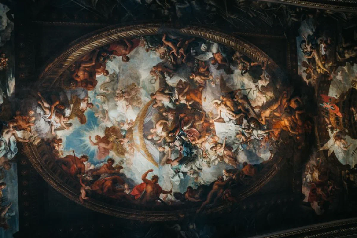 Intricate Baroque ceiling mural depicting religious themes in historic church interior.