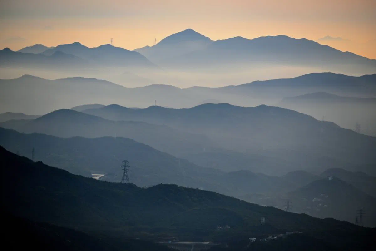 Breathtaking view of a misty mountain range at dawn. Perfect for scenic wallpapers.
