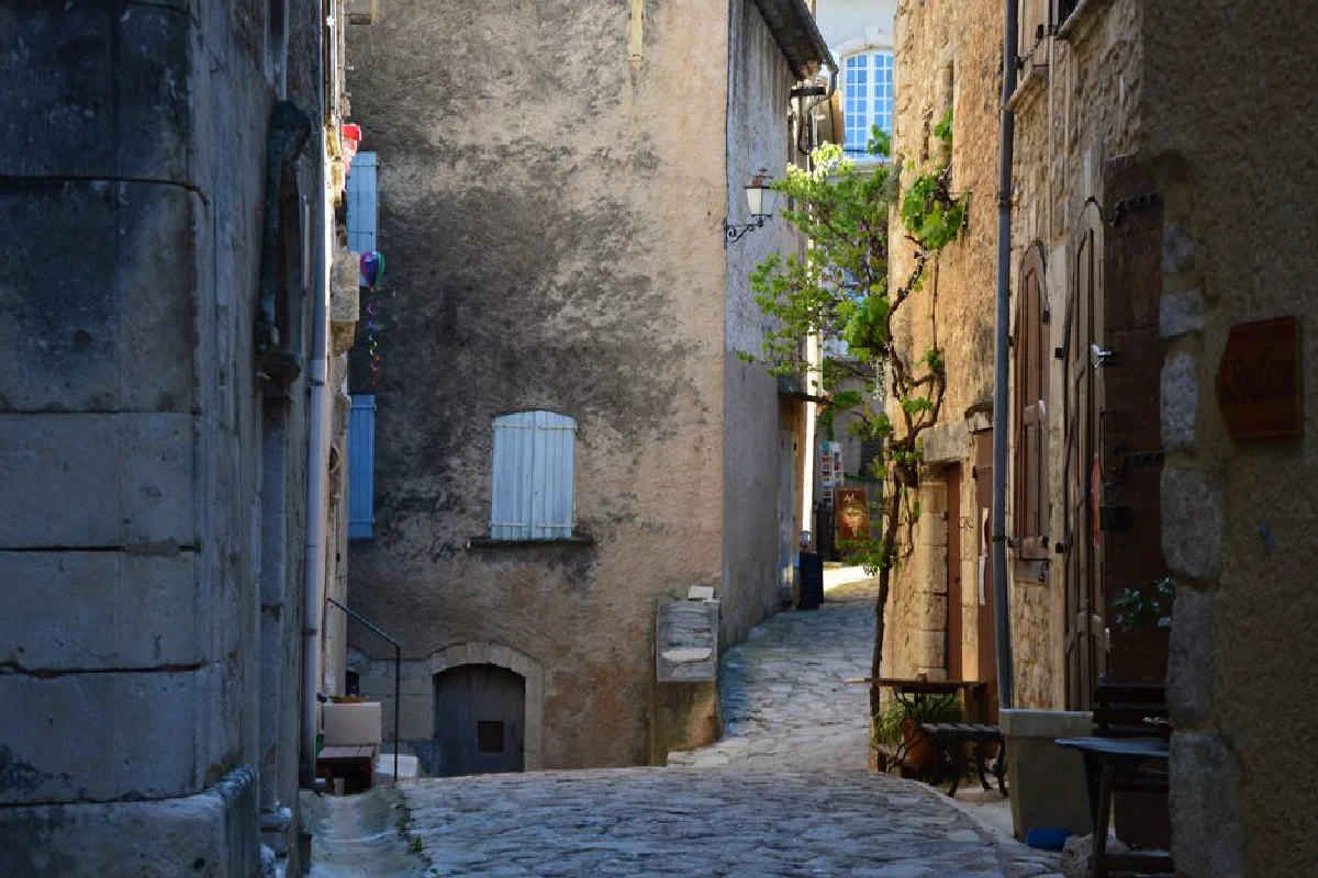 Discover a charming narrow cobblestone alleyway in an old European town, perfect for a journey through time.