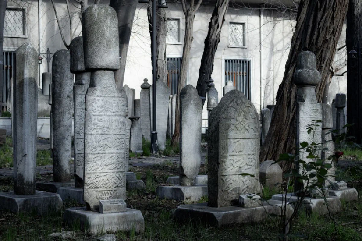 Explore an ancient Ottoman cemetery with intricate tombstones in İstanbul, Türkiye.
